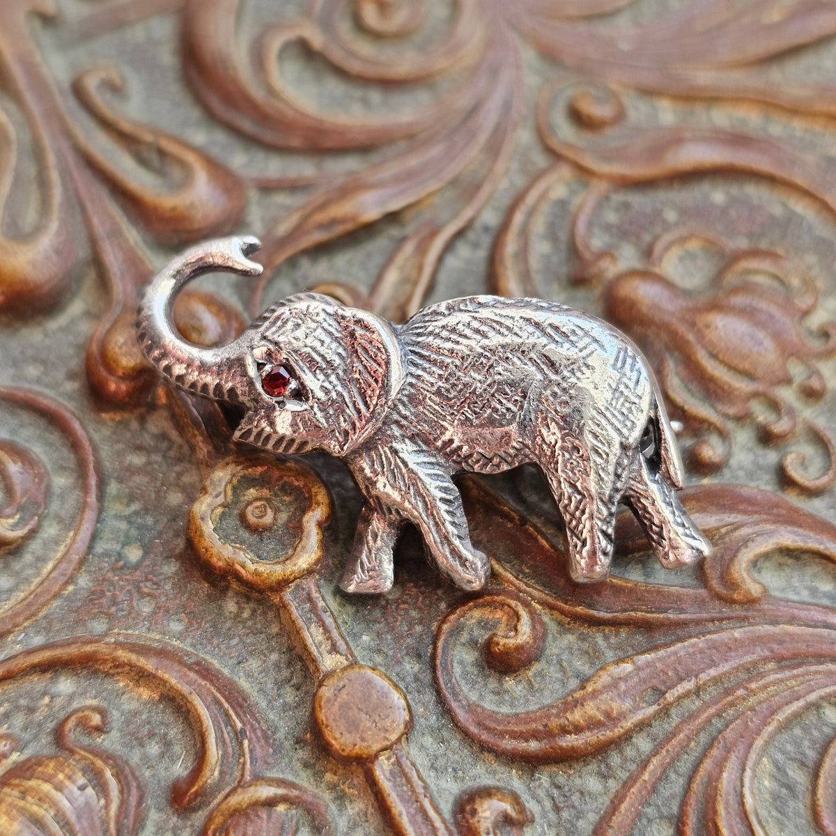 Sterling Silver Elephant Brooch with Garnet Eye