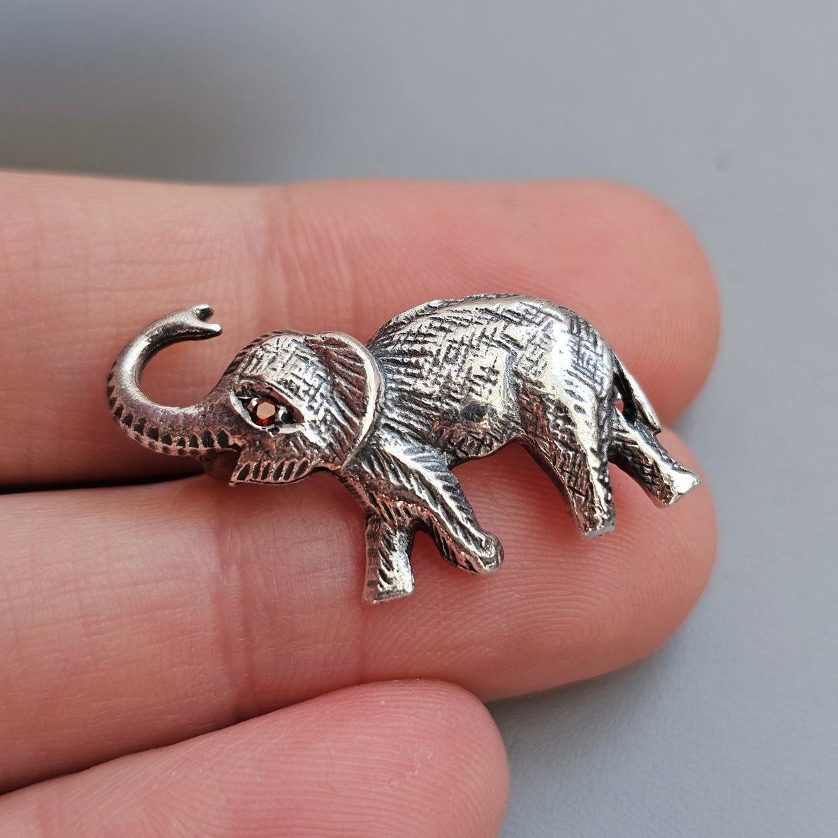 Sterling Silver Elephant Brooch with Garnet Eye