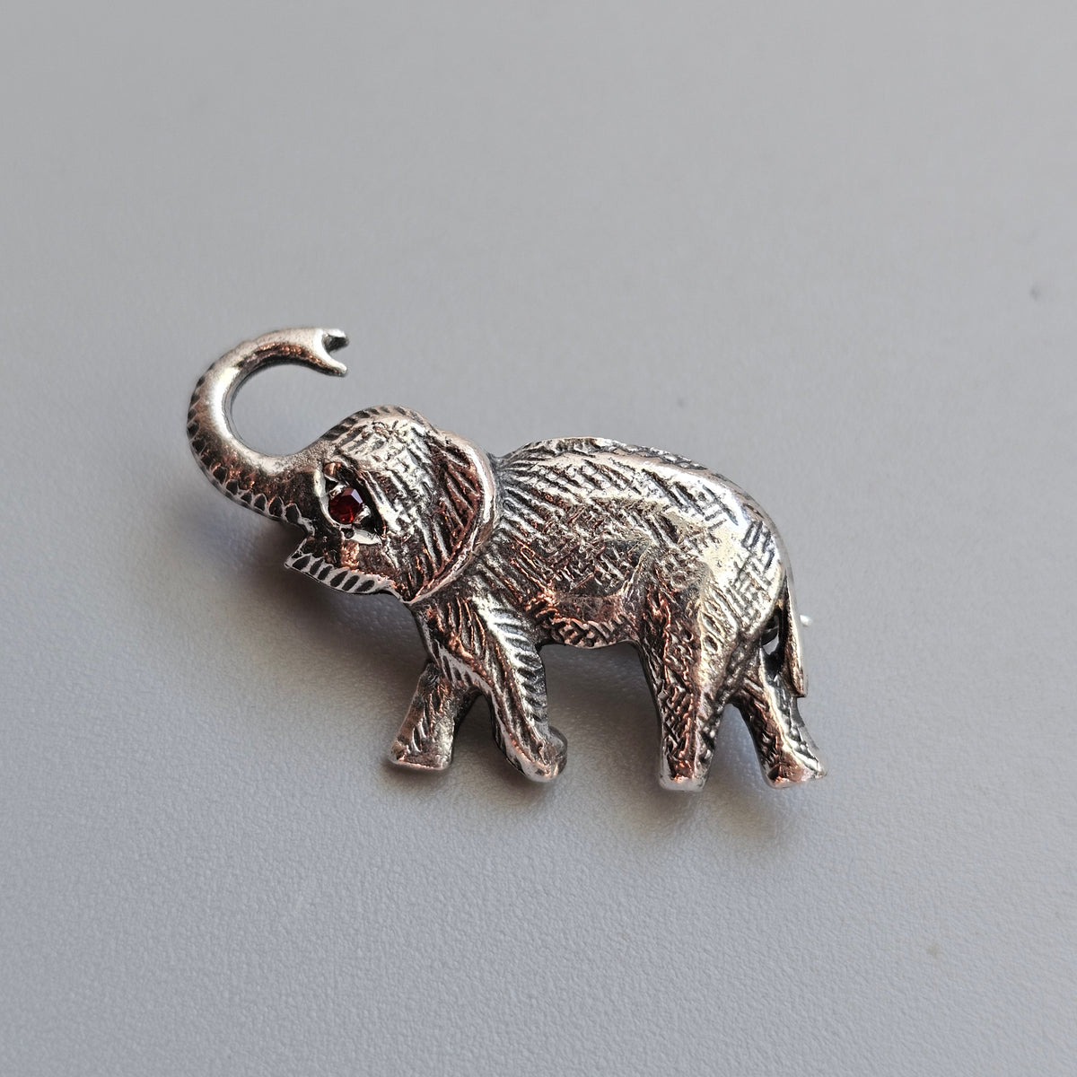 Sterling Silver Elephant Brooch with Garnet Eye