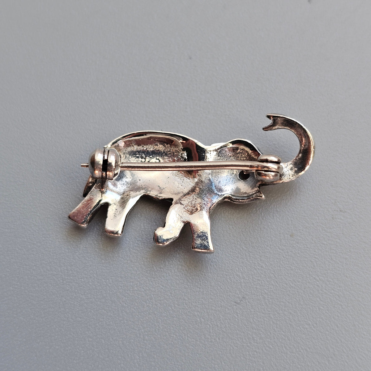 Sterling Silver Elephant Brooch with Garnet Eye