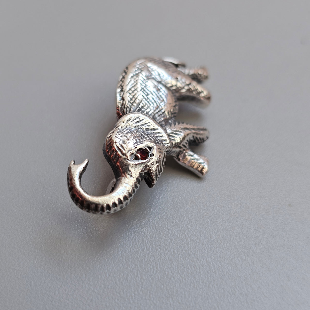 Sterling Silver Elephant Brooch with Garnet Eye